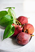 Red Batler pears on a ceramic plate