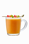 Hot orange and aniseed drink with candied fruit
