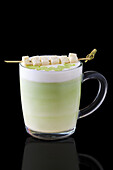 Matcha latte with coconut skewer