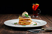 American pancakes with ice cream, banana and nut butter