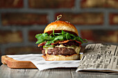 Bacon cheeseburger with rocket salad