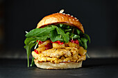 Chicken burger with rocket and grilled vegetables