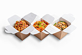 Asian noodle dishes in take-away boxes