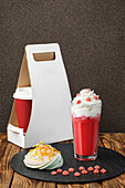 Strawberry coffee with whipped cream and meringue tartlets