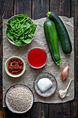 Ingredients for zucchinis stuffed with barley, spinach and mozzarella