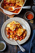 Potato and sausage casserole with vegetables