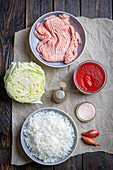 Ingredients for chicken, rice and cabbage balls in tomato sauce