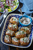 Baked potatoes with cream cheese, herbs and sun-dried tomatoes