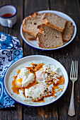 Poached eggs with tzatziki and chili butter