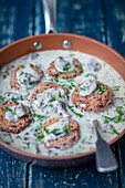 Bean cakes with mushroom sauce