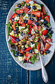 Summery watermelon salad with berries and feta