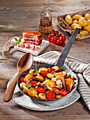 Farmhouse pan with potatoes, leftovers and bacon