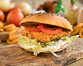 Crispy chicken burger with tomato and lettuce