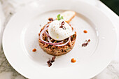 Steak tartare with poached egg and onions