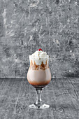 Iced coffee with whipped cream and cherries