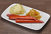 Bratwurst with mashed potatoes and sauerkraut