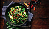 Green vegetables with sesame brittle from the pan