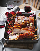 Slow-roasted pork belly with chestnuts and radicchio