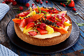 Fruit tart with papaya and summer berries