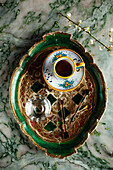 Traditional coffee service with mocha and a glass of water