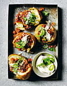 Baked potatoes with kidney beans, chilli and sour cream