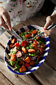 Summer salad with cherry tomatoes and fried salmon