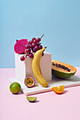 Various tropical fruits on a colourful background