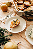 Baked pears with blue cheese, honey and herbs