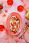 Summer salad with avocado, burrata and strawberries