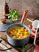 Autumn vegetable stew with Brussels sprouts, chestnuts and sausages