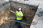 Engineer replacing lead water pipes