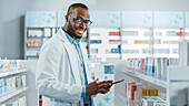 Pharmacist smiling in pharmacy