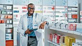 Pharmacist smiling in pharmacy