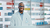 Pharmacist behind pharmacy counter