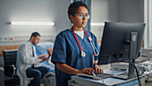 Healthcare professional using computer in hospital