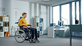 Male patient sitting in wheelchair in clinic