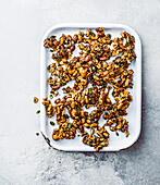 Caramelised nuts and seeds with miso dressing