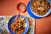 Harissa beef with tomato bulgur and spicy pasta with sweetcorn and kidney beans