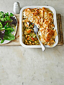 Oven-baked bean and leek casserole with salad