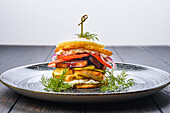 Potato pancake burger with chicken breast and bacon