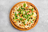 Pizza with walnuts, truffle oil and maple syrup