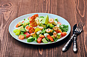Salad with avocado, peppers, feta cheese and prawns