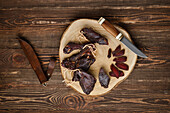 Dried venison on a wooden board with a hunting knife