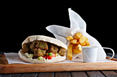 Pita bread with falafel and chips