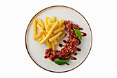 Beef tartare with balsamic sauce and chips