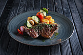 Grilled fillet of beef with vegetable skewer and croquettes