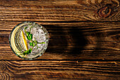 Refreshing lemon water with ice cubes and bean sprouts