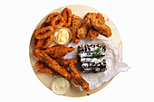 Mixed snack platter with onion rings and chicken wings