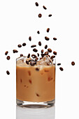 Irish coffee cocktail with ice and coffee beans