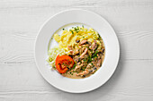 Chicken goulash with mushrooms, mashed potatoes and tomato and cabbage salad